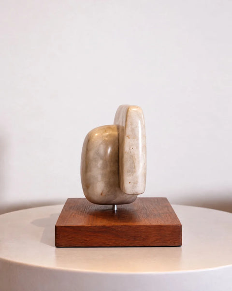 Side view showing the depth of the marble sculpture and metal support
