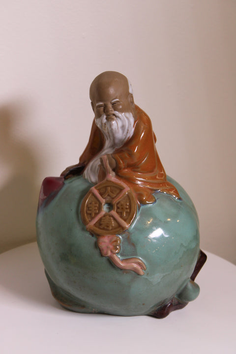 Celadon Glazed Laughing Elder Figure