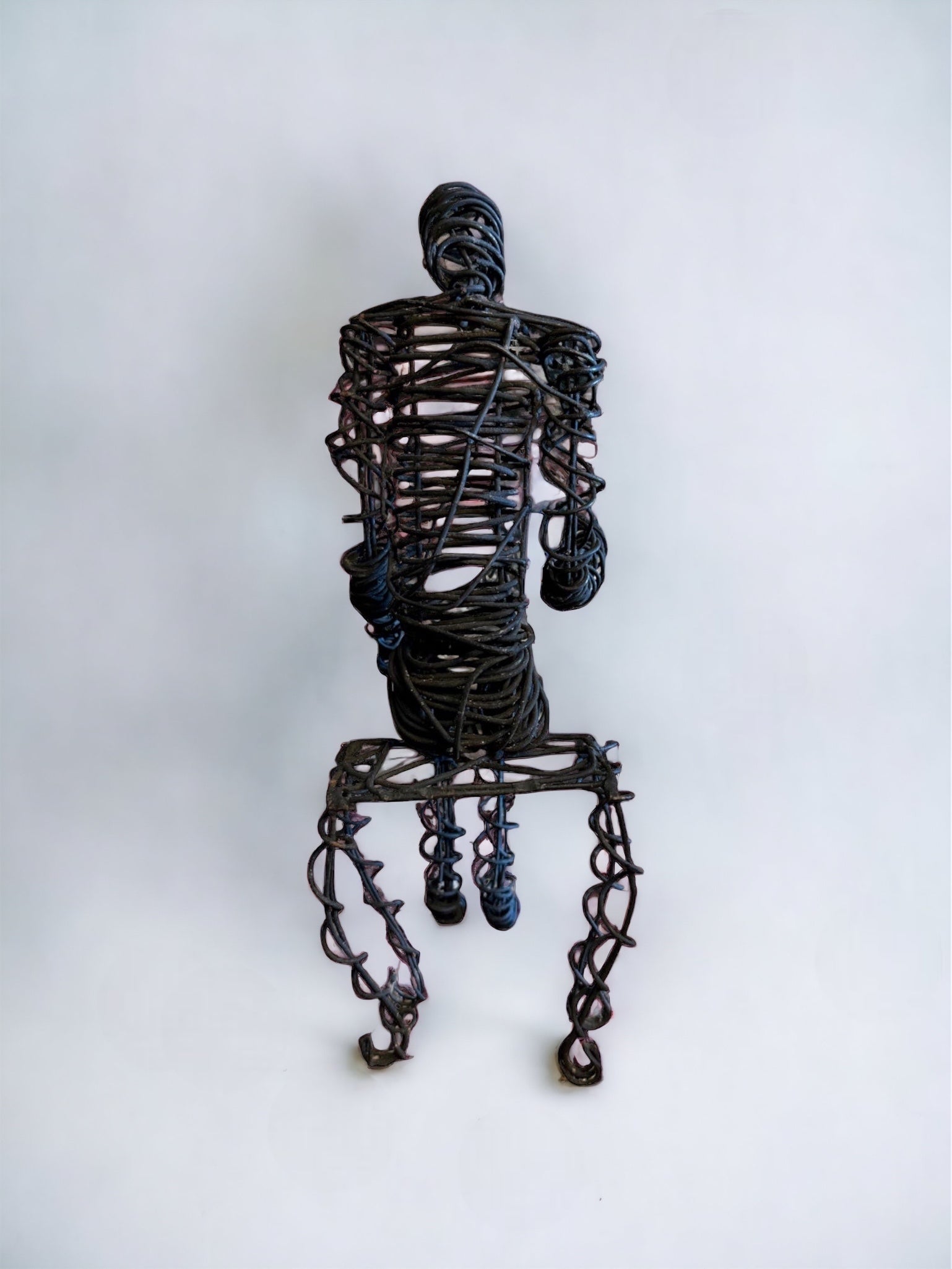 Brutalist Wire Man Sitting Man