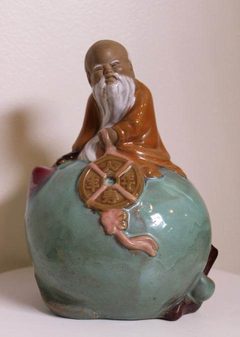 Celadon Glazed Laughing Elder Figure