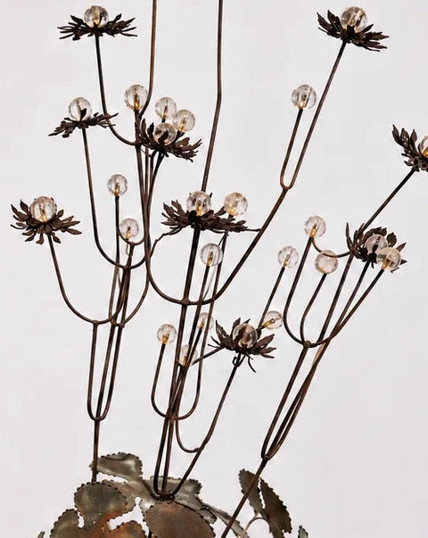 Detail of layered metal flower petals and clear round bead accents