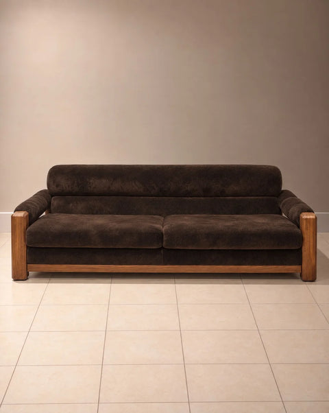 Front view of chocolate brown velvet sofa with exposed wood posts and two seat cushions