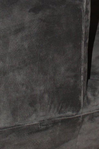 Close-up of charcoal velvet upholstery seams