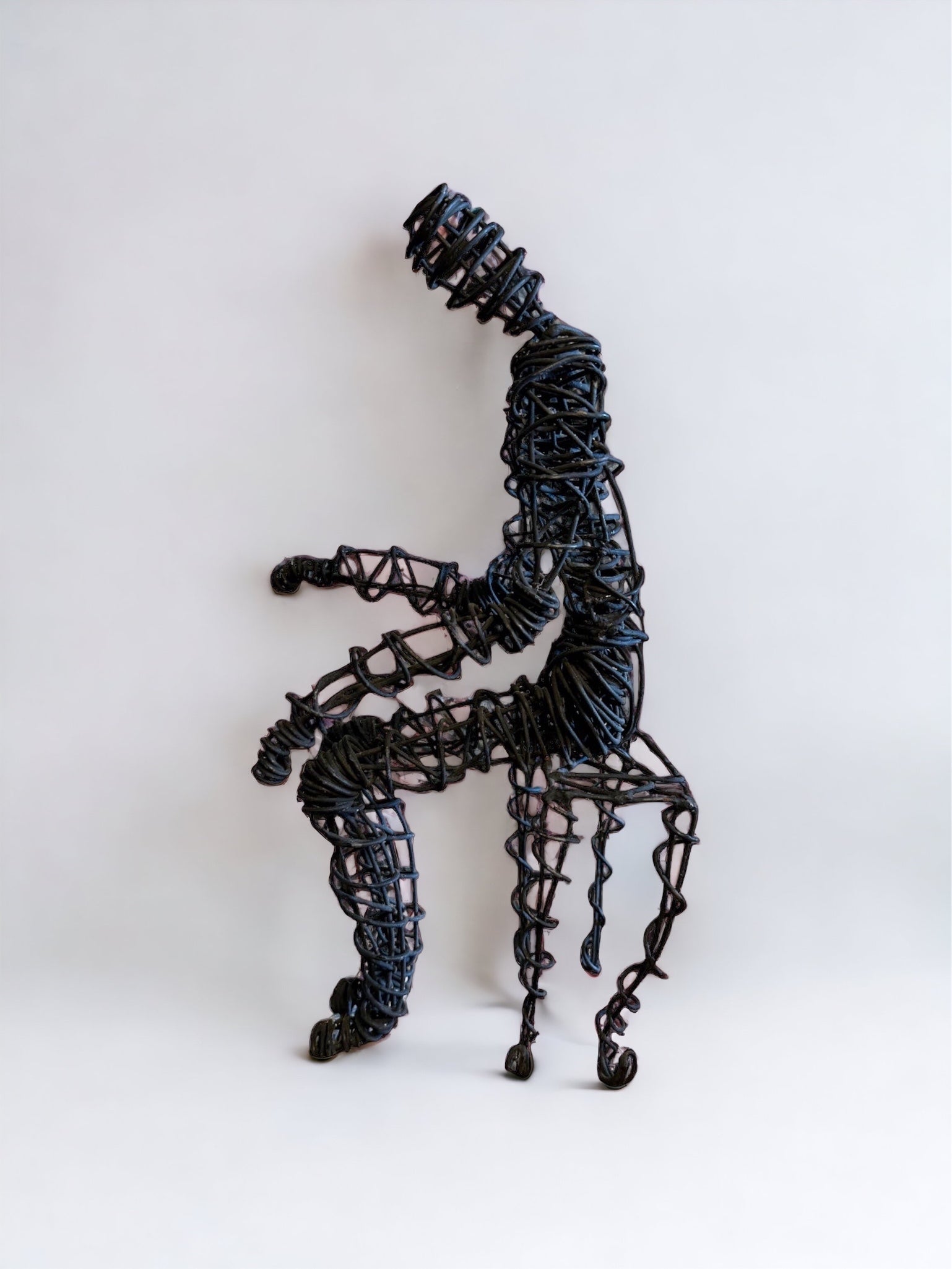 Brutalist Wire Man Sitting Man