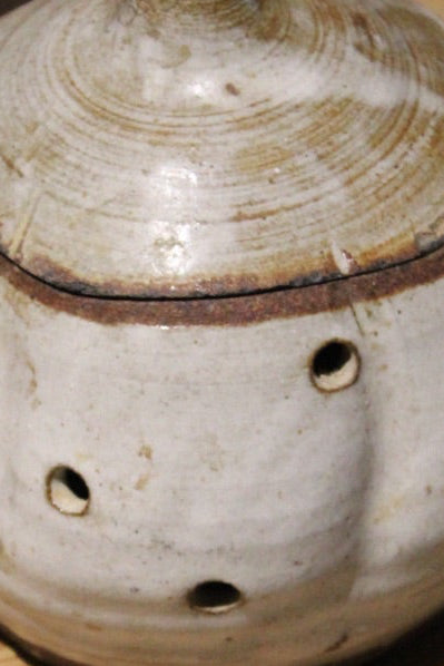 Cream Glazed Pierced Pottery Jar with Lid — detail view